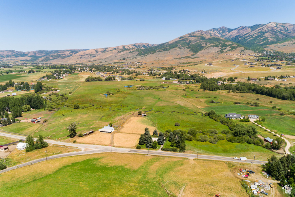 Birds eye view of property with a mountain view and a rural view