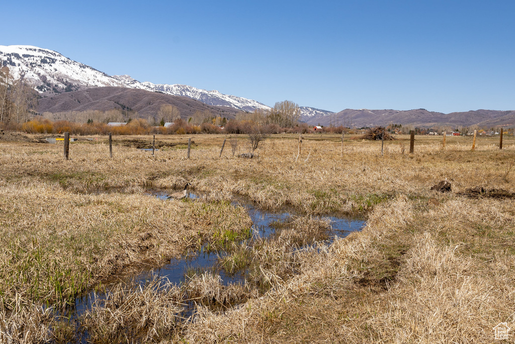 Property view of mountains with a rural view