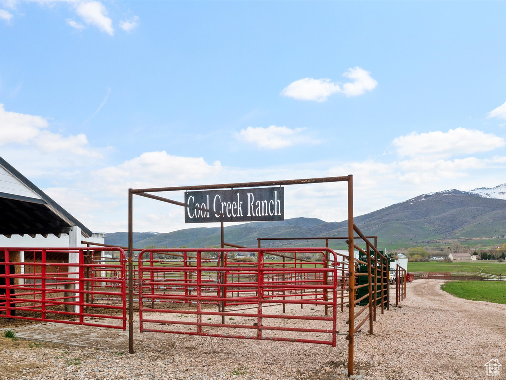 Exterior space featuring a mountain view, a rural view, and an outdoor structure