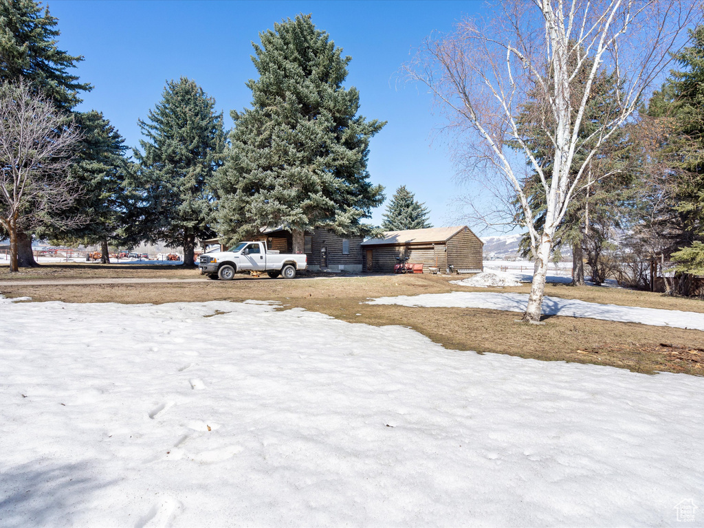 View of yard covered in snow