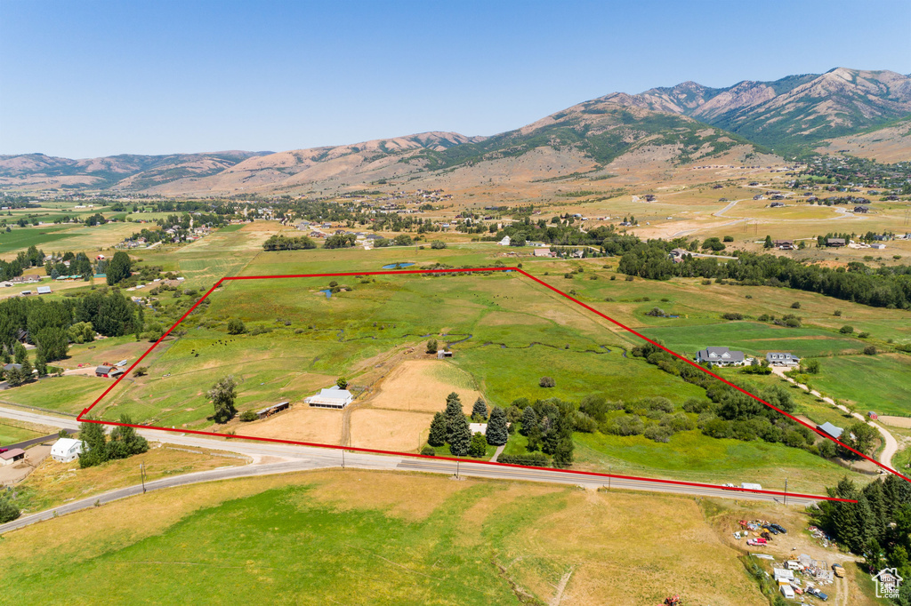 Birds eye view of property featuring a mountain view and a rural view