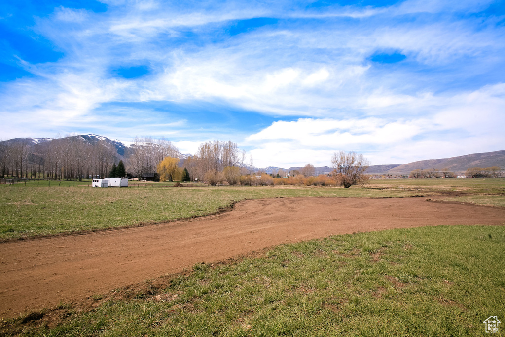 View of yard with a mountain view and a rural view