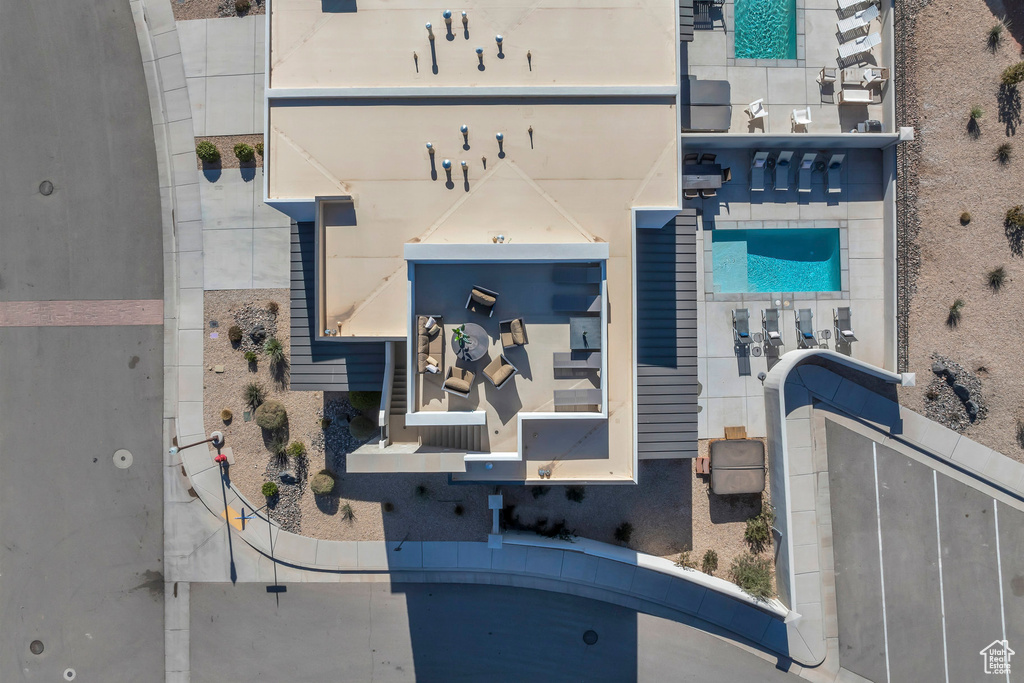 Aerial view of property and surrounding area with a pool area