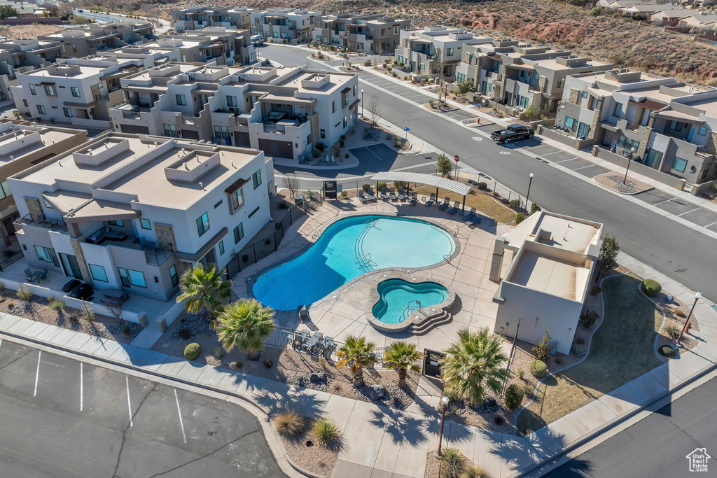 Aerial perspective of suburban area featuring a pool