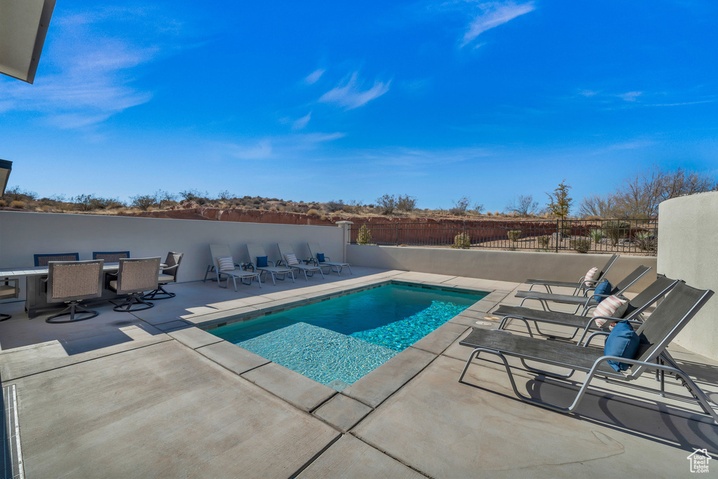 View of pool featuring a patio area and outdoor dining area