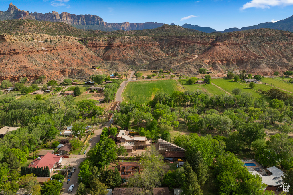 Aerial overview of property's location featuring a mountainous background