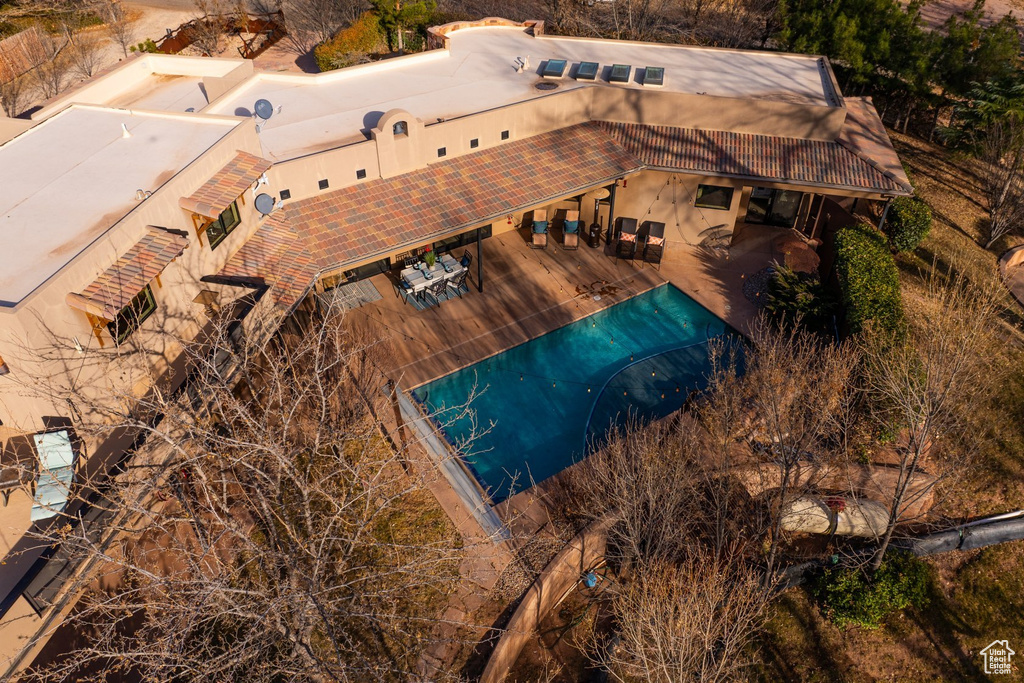 Aerial view of property and surrounding area with a pool