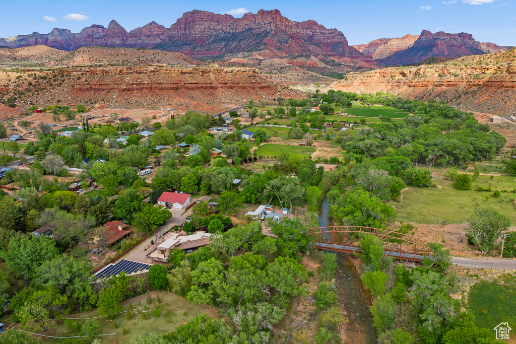 Aerial overview of property's location with a mountainous background