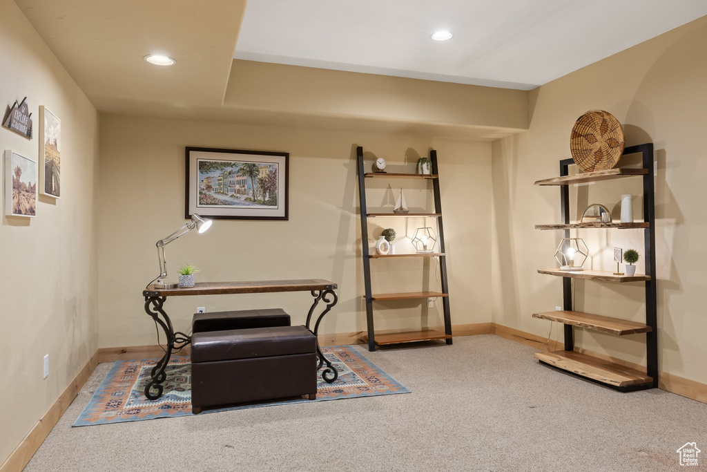 Living area with carpet, baseboards, and recessed lighting