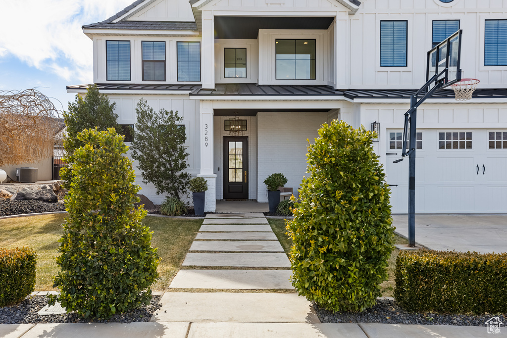 View of front facade featuring a garage