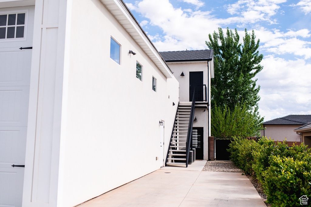 Doorway to property featuring a patio area