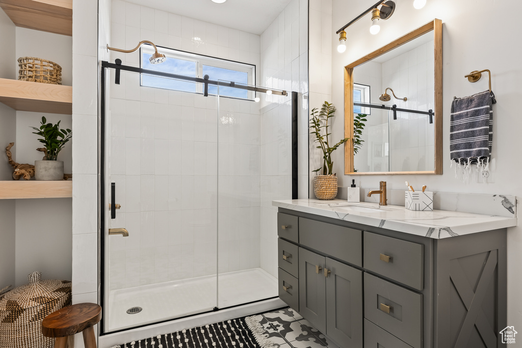 Bathroom with an enclosed shower and vanity