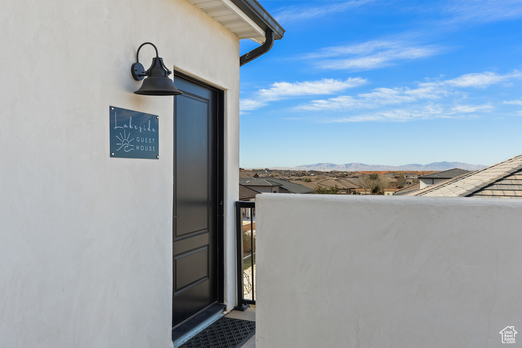 Property entrance featuring a mountain view and a balcony