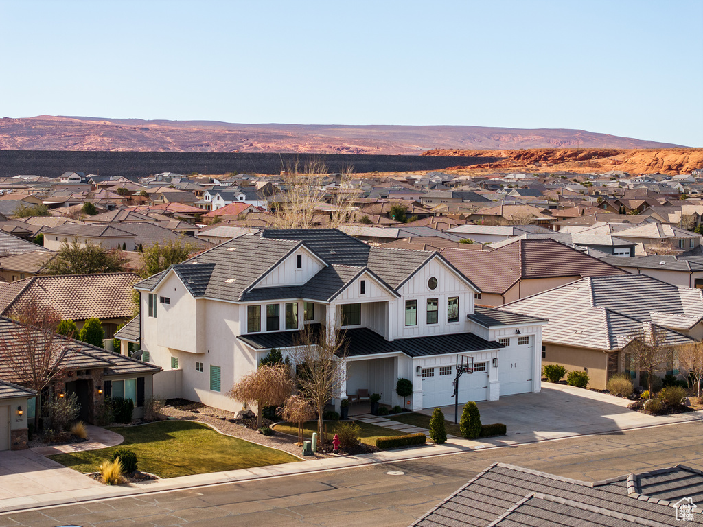 Birds eye view of property with a mountain view