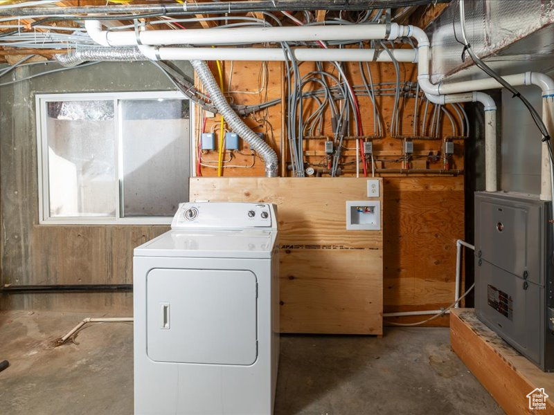Washroom featuring washer / dryer