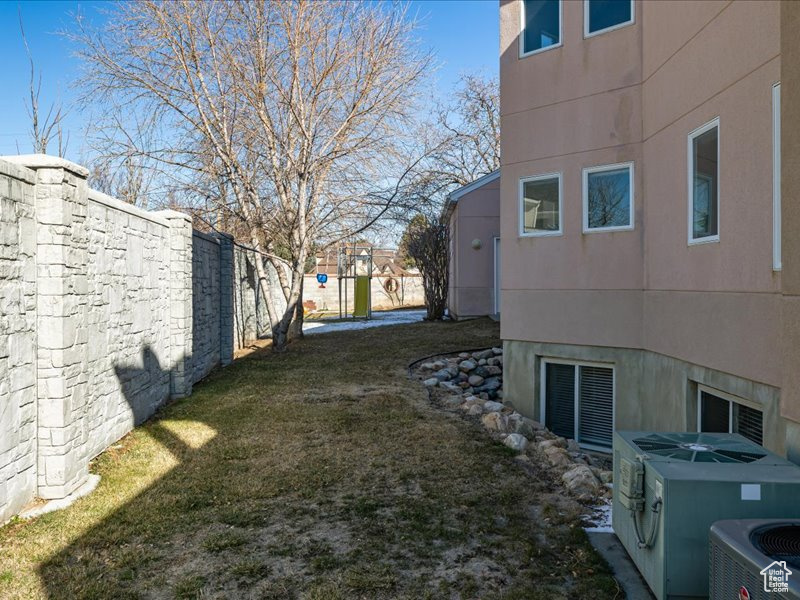 View of yard featuring central air condition unit