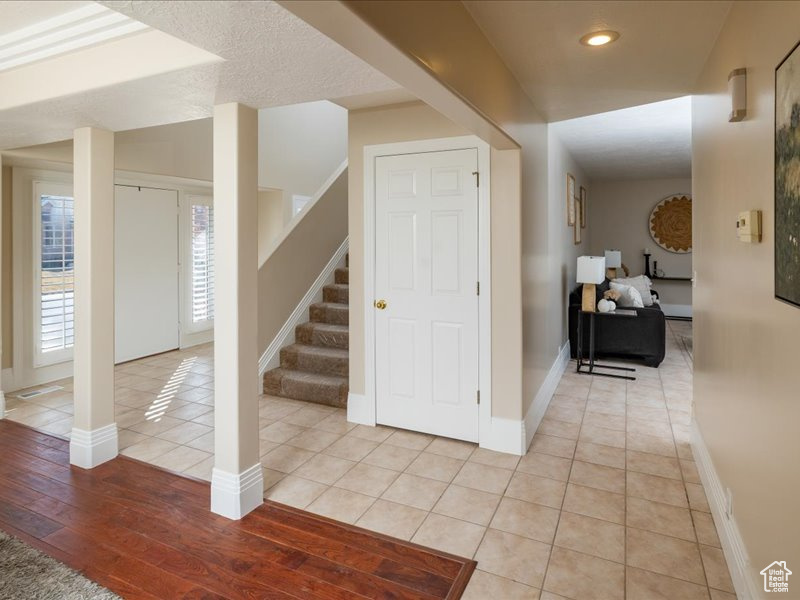 Hall with light tile patterned floors
