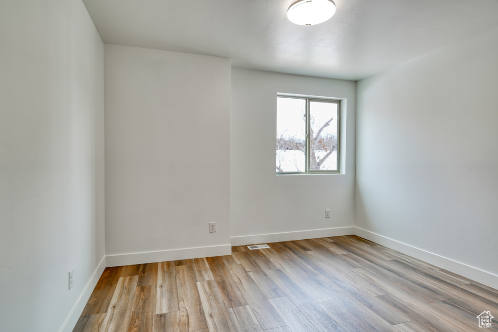 Unfurnished room with light hardwood / wood-style flooring