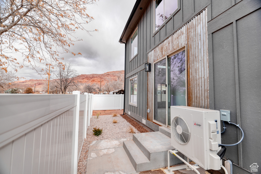 Exterior space with a mountain view and ac unit
