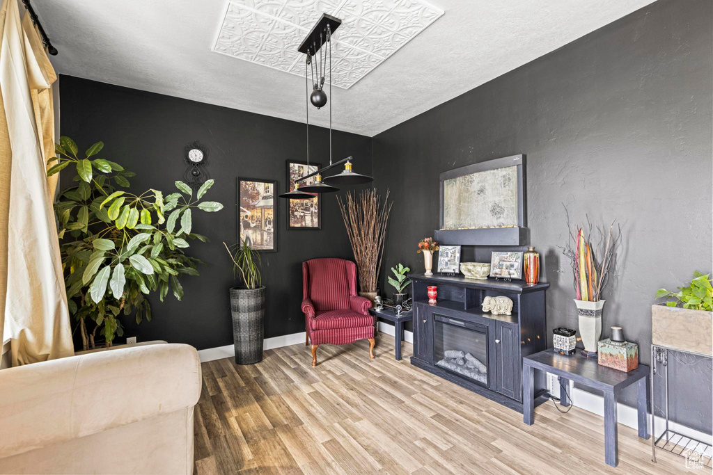 Sitting room with wood-type flooring