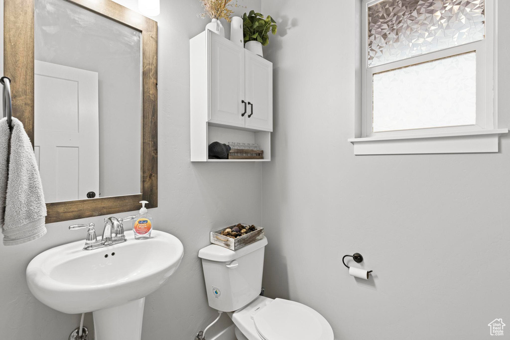 Bathroom with sink and toilet