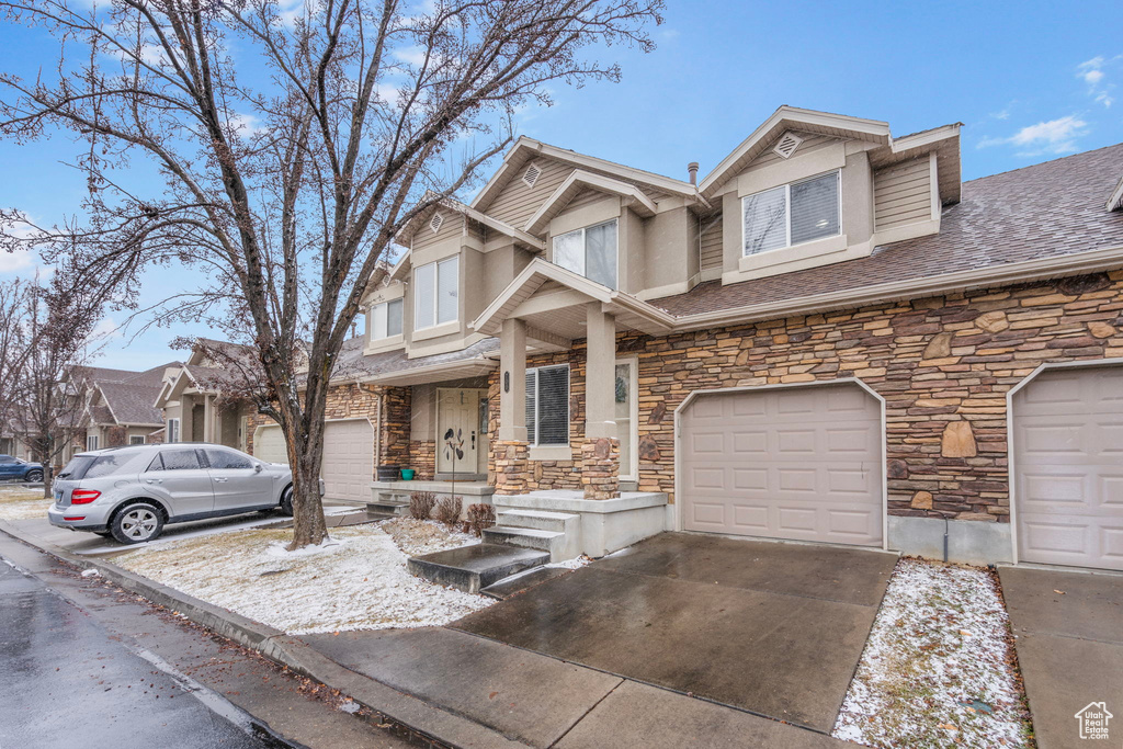 View of front of property with a garage