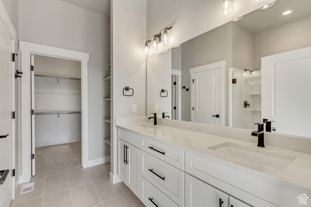 Bathroom with vanity and tile patterned flooring