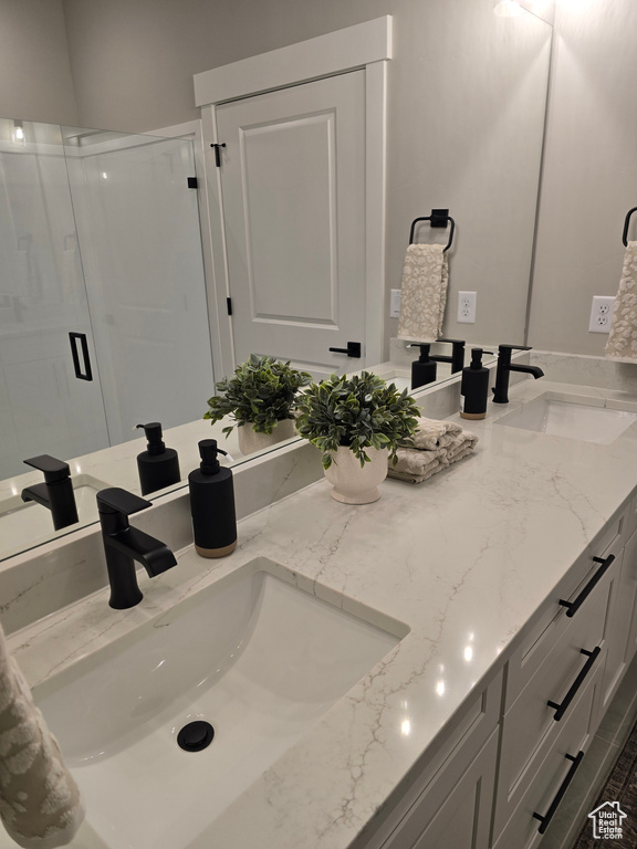 Bathroom with vanity and walk in shower