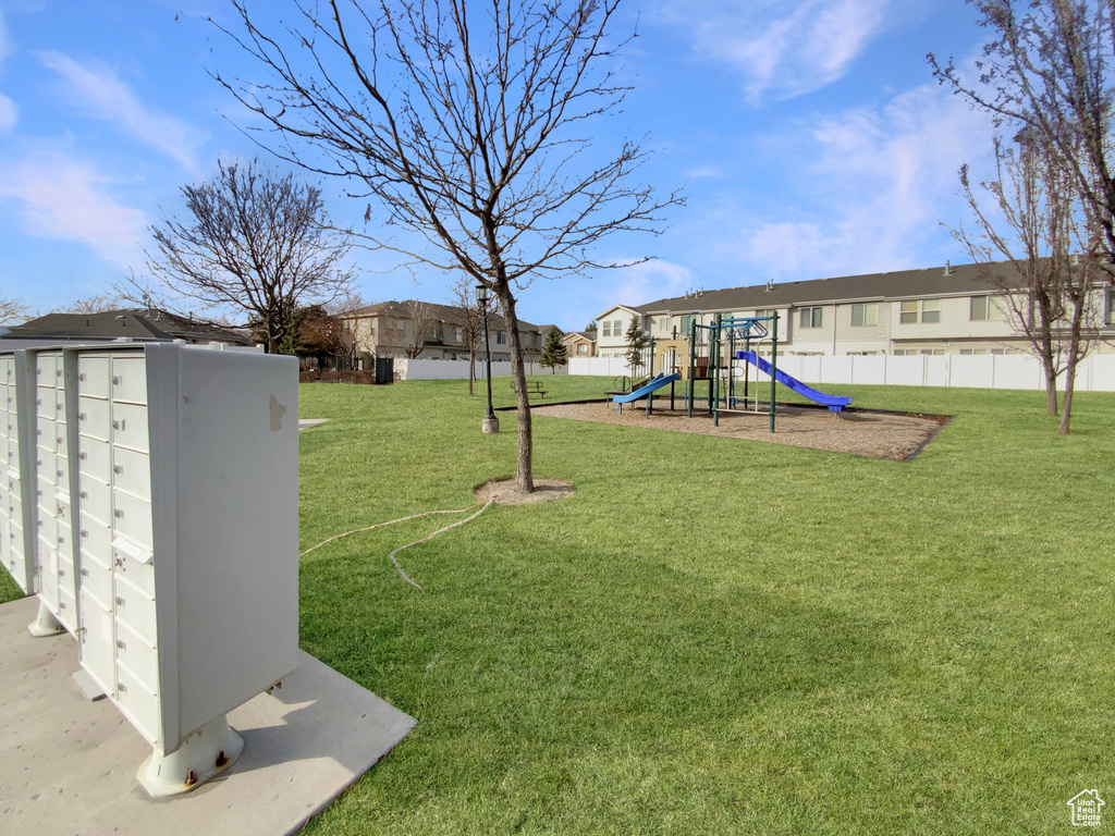 View of playground featuring a yard