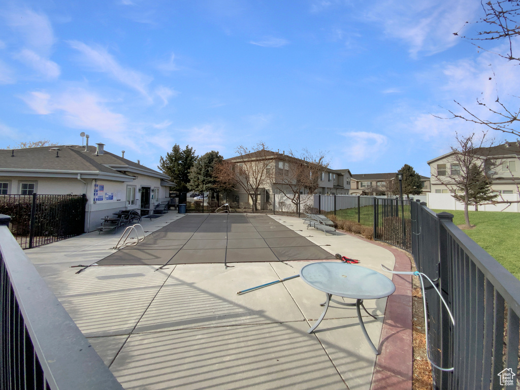 View of swimming pool with a patio area