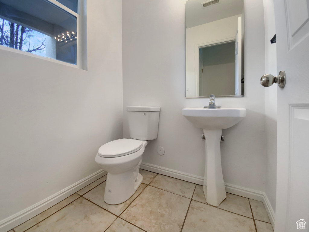 Bathroom featuring tile patterned flooring and toilet