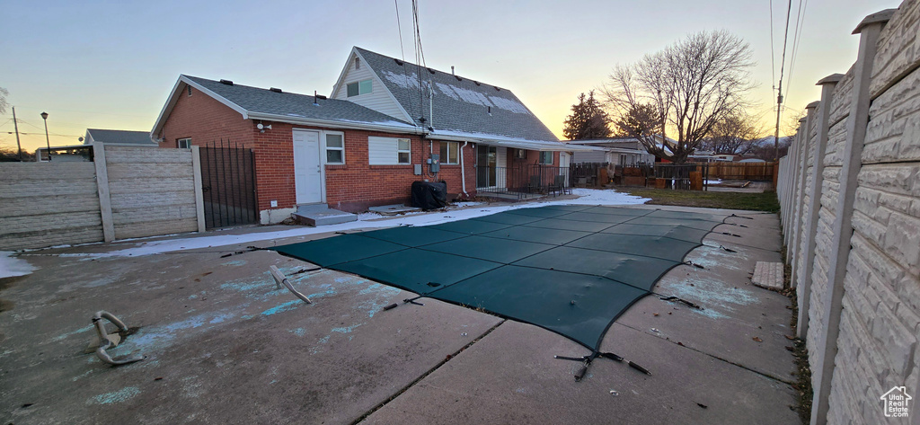 View of pool at dusk