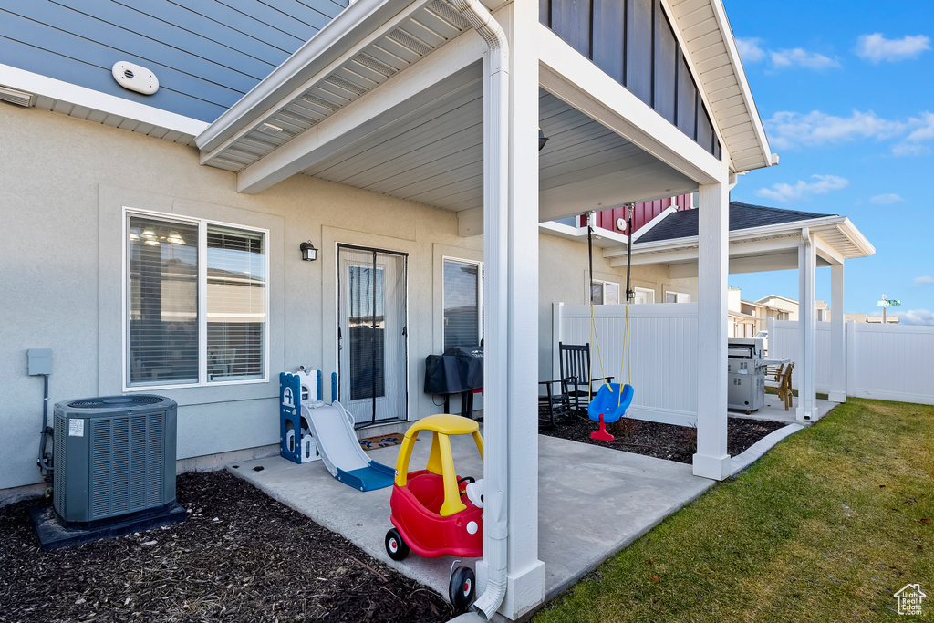 View of patio / terrace with central AC and fence