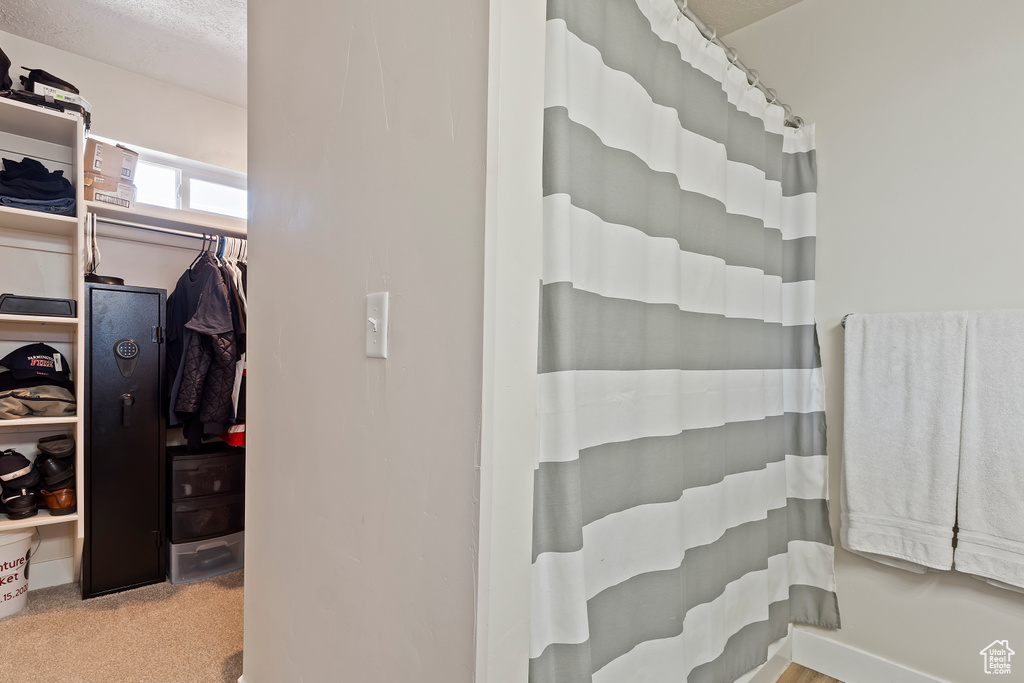 Bathroom with a shower with shower curtain
