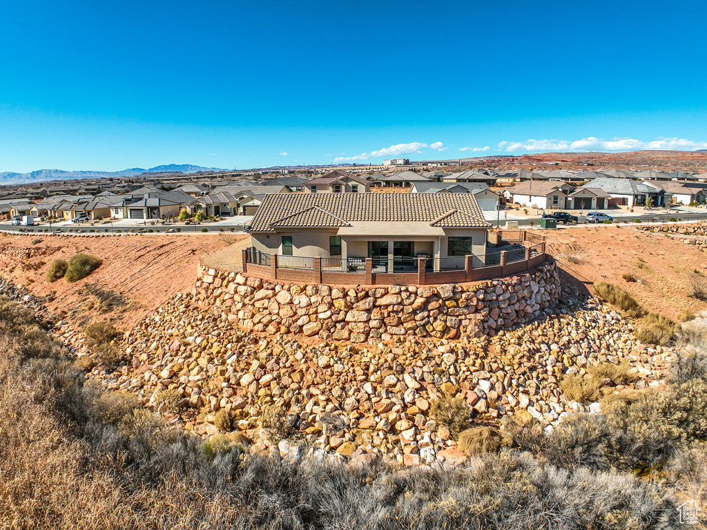 Rear view of house with a mountain view