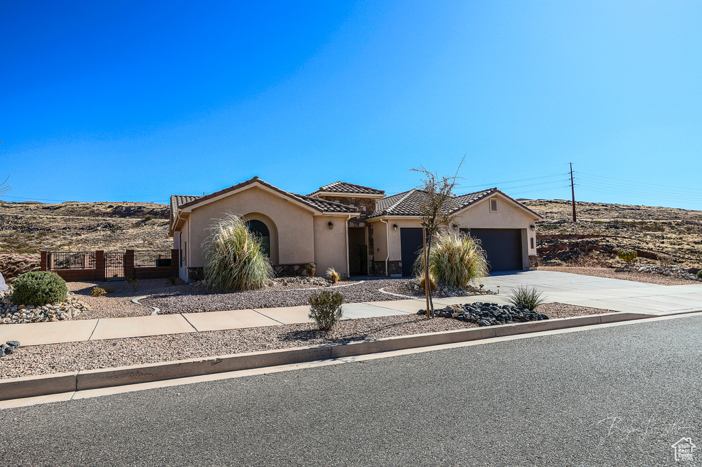 View of front of home featuring a garage