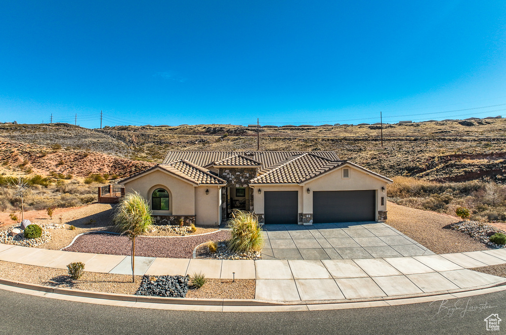 View of front of property with a garage