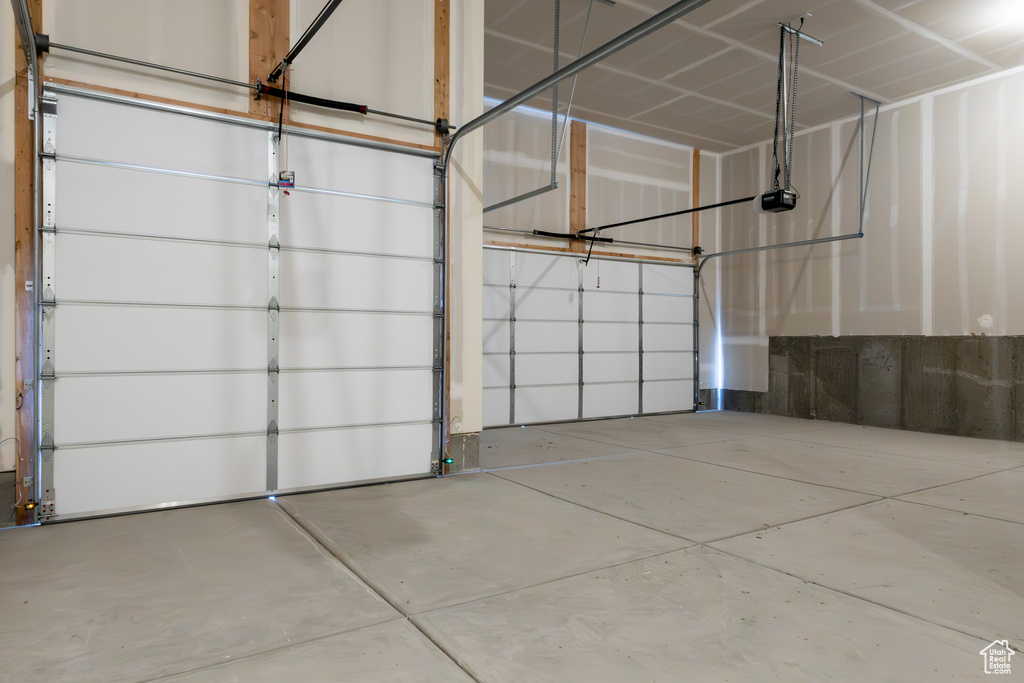 Garage featuring a garage door opener