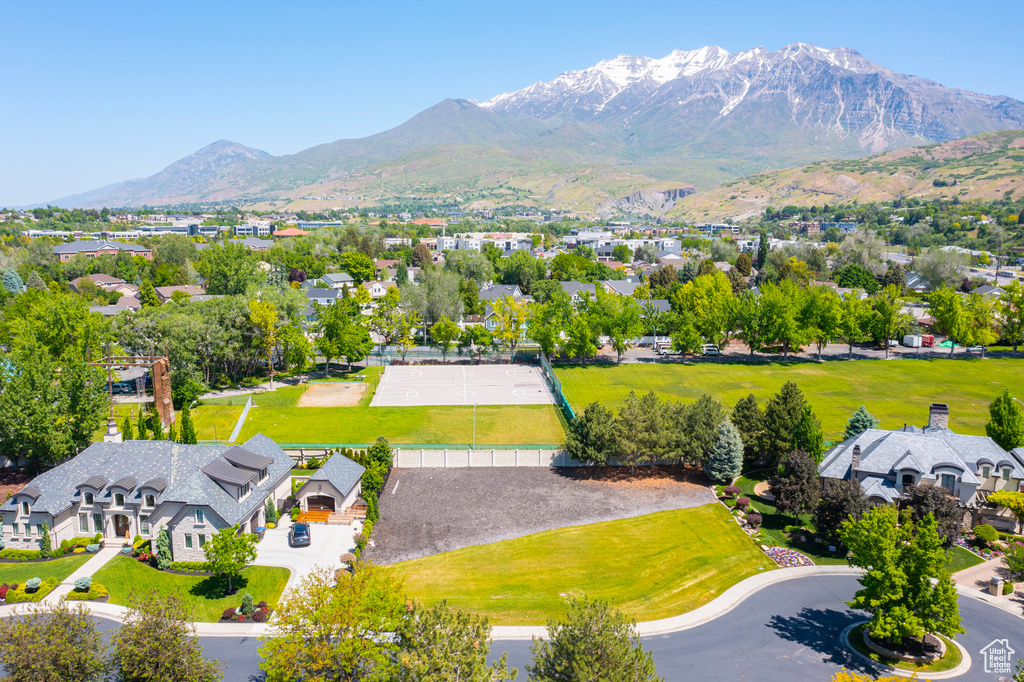 Aerial perspective of suburban area featuring a mountain backdrop