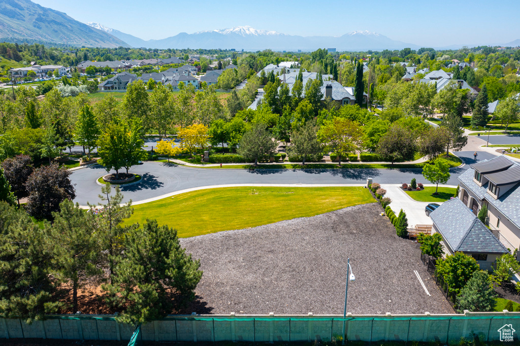 Aerial perspective of suburban area featuring a mountain backdrop