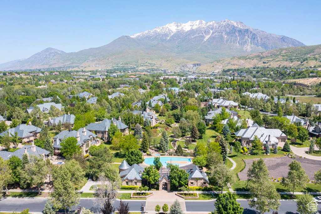 Aerial view of residential area featuring a mountainous background