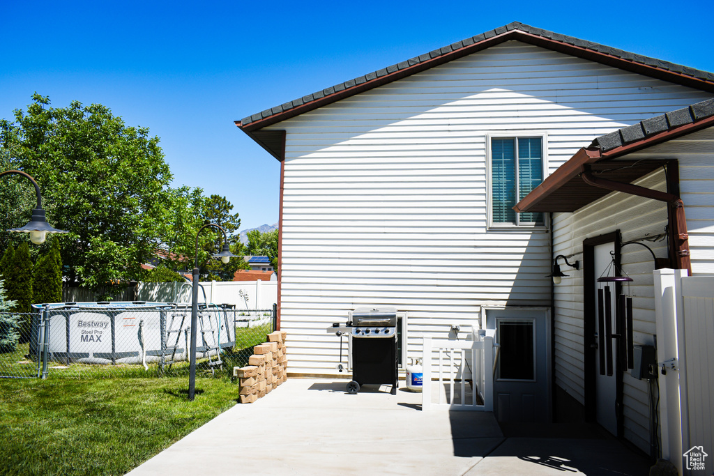 Back of property featuring a patio area