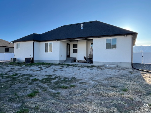 Rear view of house with fence