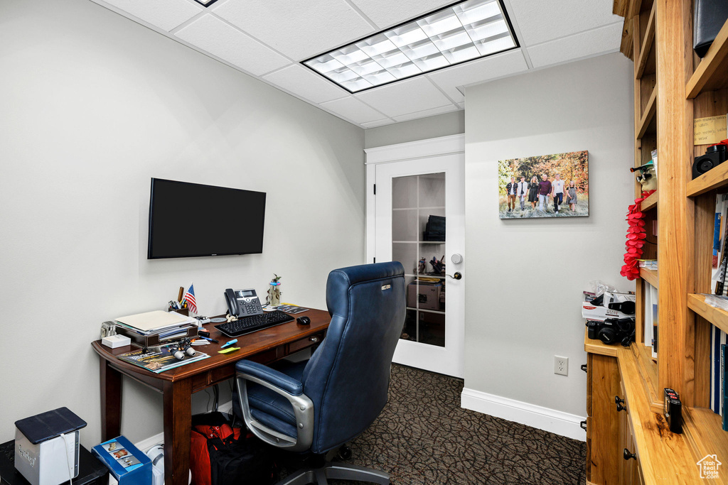 Office area featuring a paneled ceiling