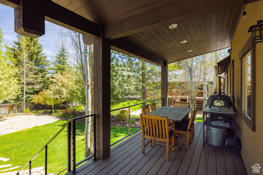 Wooden terrace featuring outdoor dining space