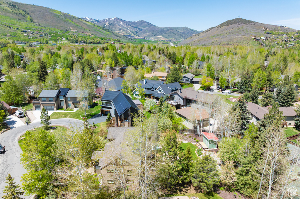 Aerial view of residential area featuring mountains