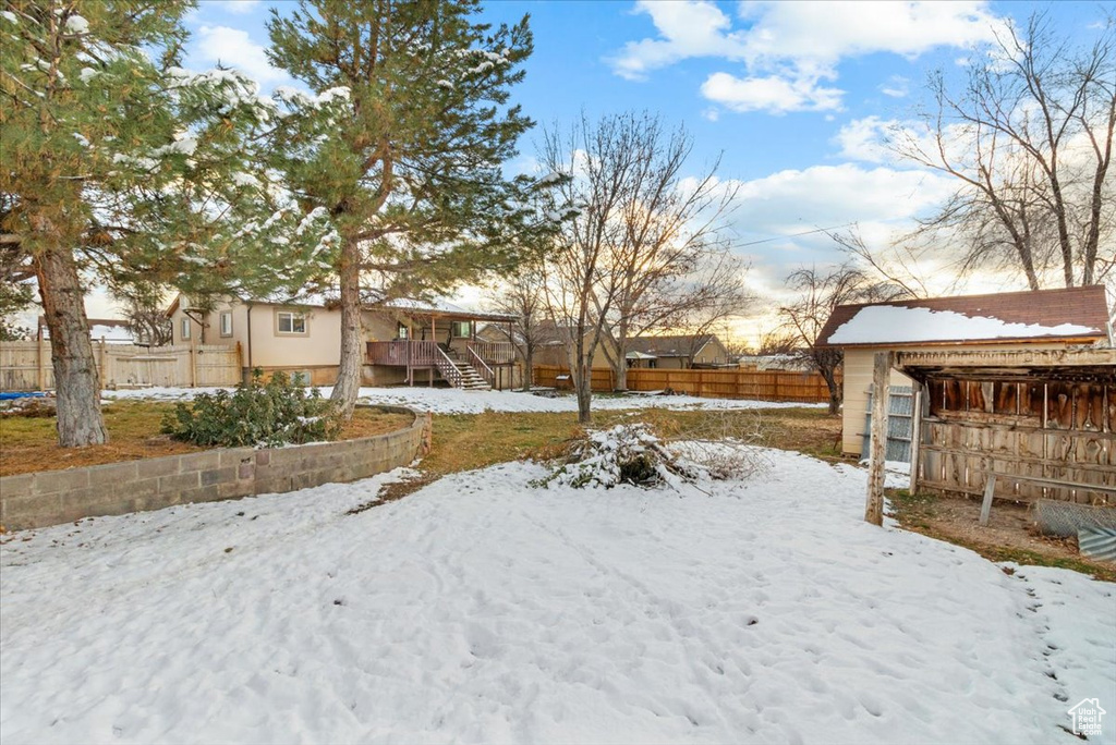 View of yard layered in snow