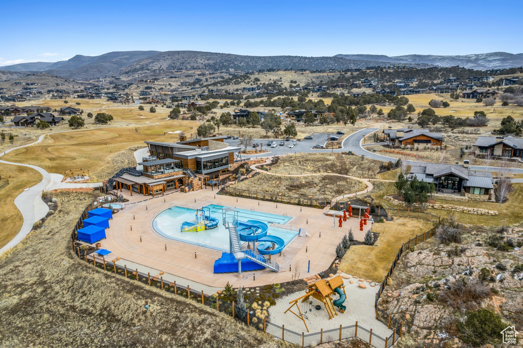 Birds eye view of property with a mountain view