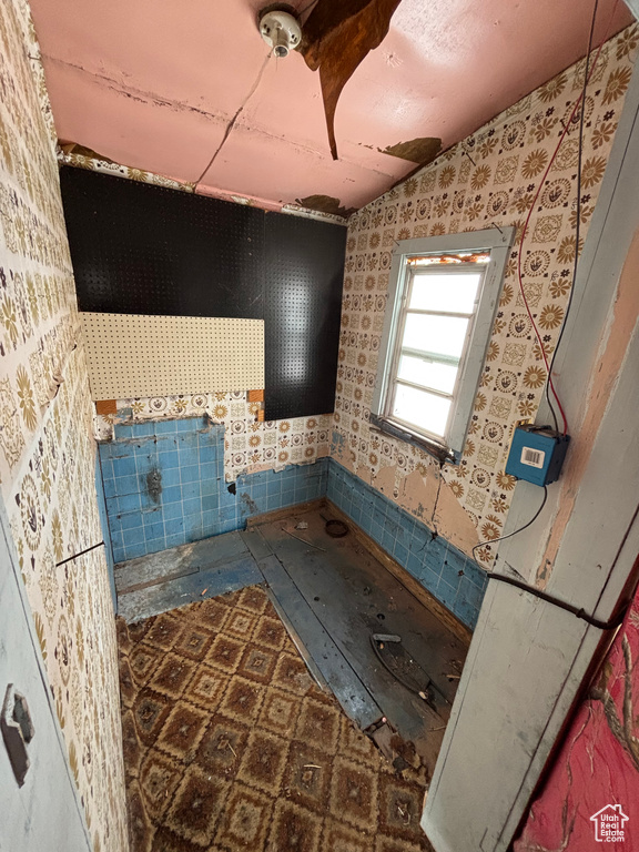 Bathroom featuring lofted ceiling