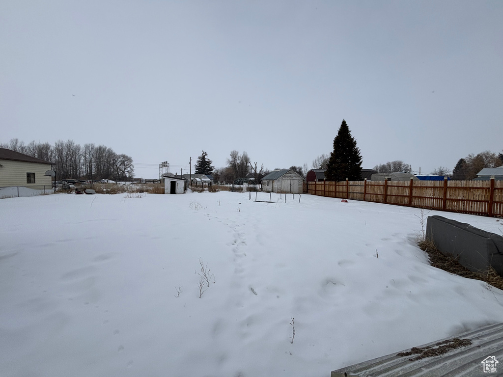 View of yard layered in snow